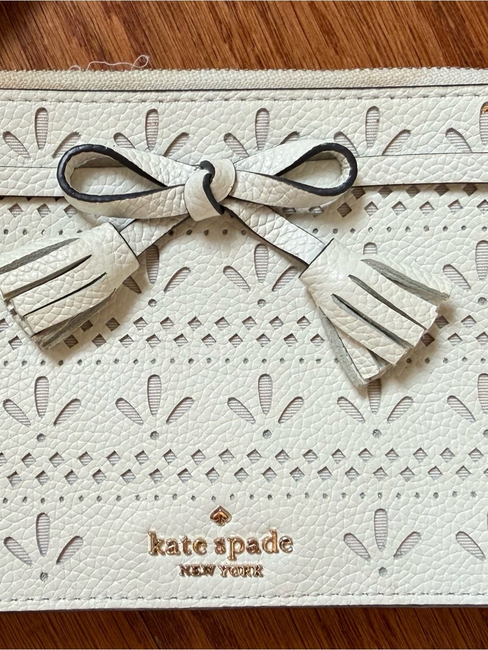 kate spade White Perforated Leather Wristlet with Bow Tassels - Picture 2 of 5